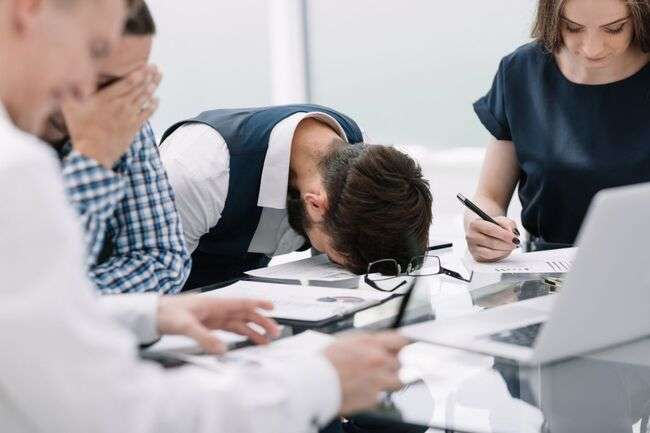 Group of stressed professionals during a meeting