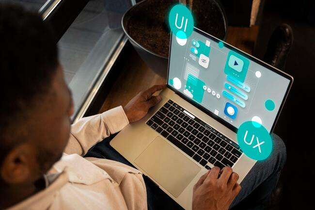 Lawyer reviewing small law firm website on a laptop, ensuring top-notch client service.